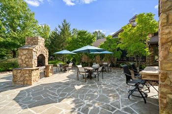 Patio with stone fireplace